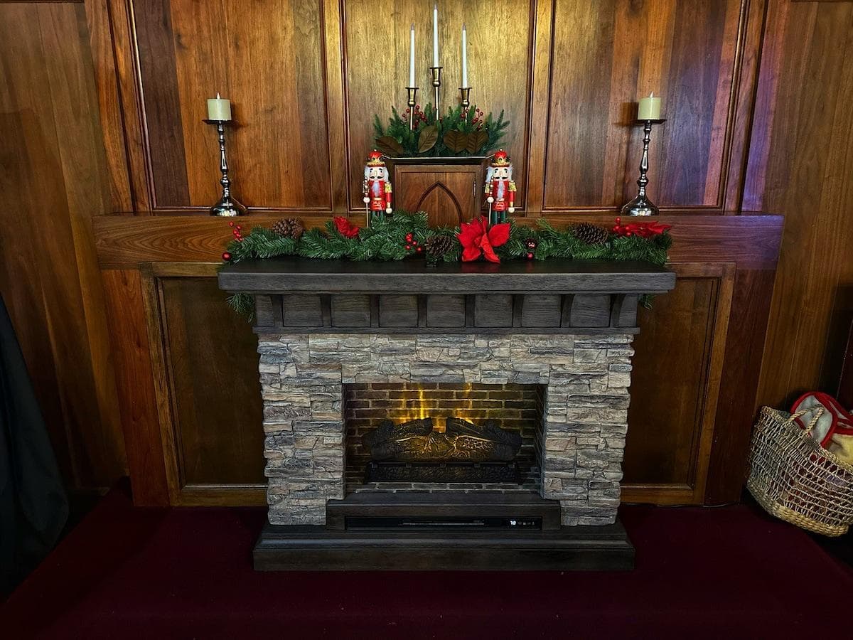 The glow of the main fireplace dressed up with the glow of the season. 