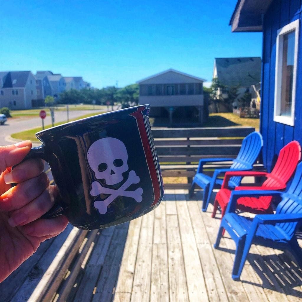 The east facing deck right outside the front door makes a comfortable spot for watching sunrises or having a beverage and relaxing after a day at the beach.